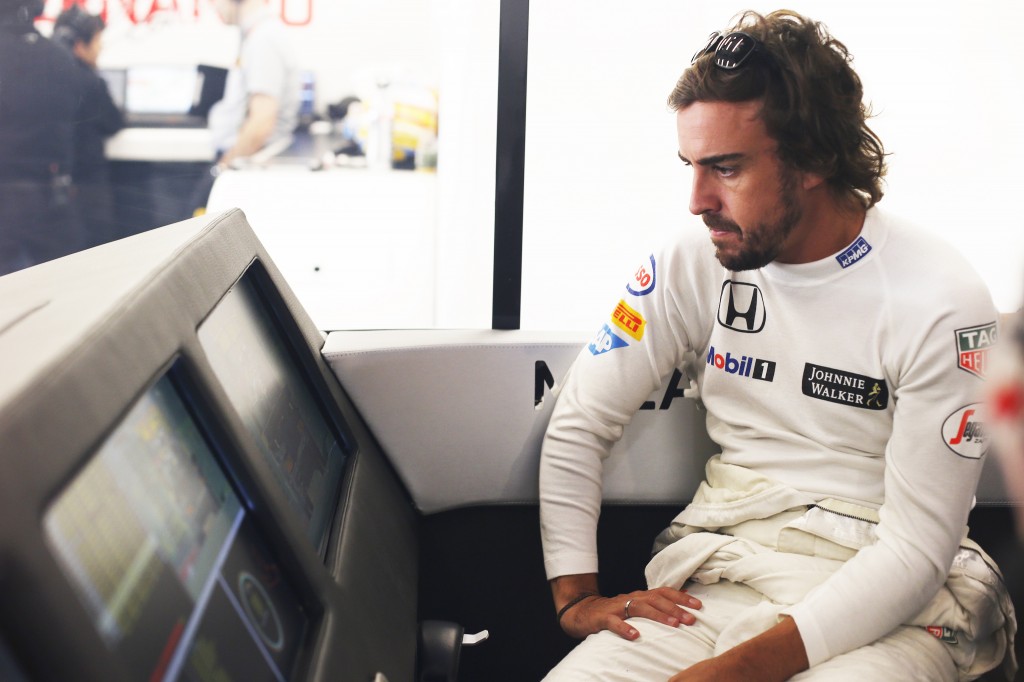 Fernando Alonso in the garage.